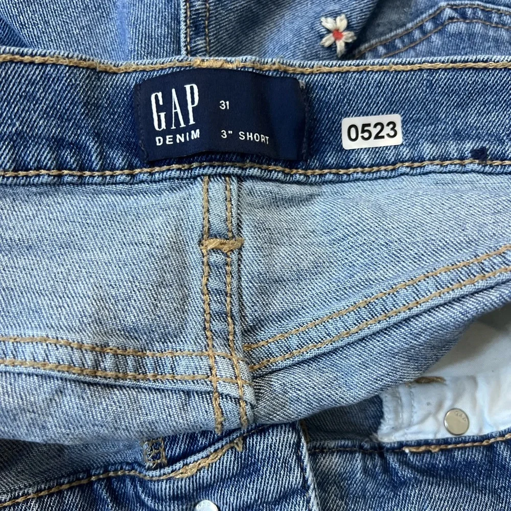 GAP Blue Denim Jean Shorts with Frayed Hem and Floral Embroidered Accents